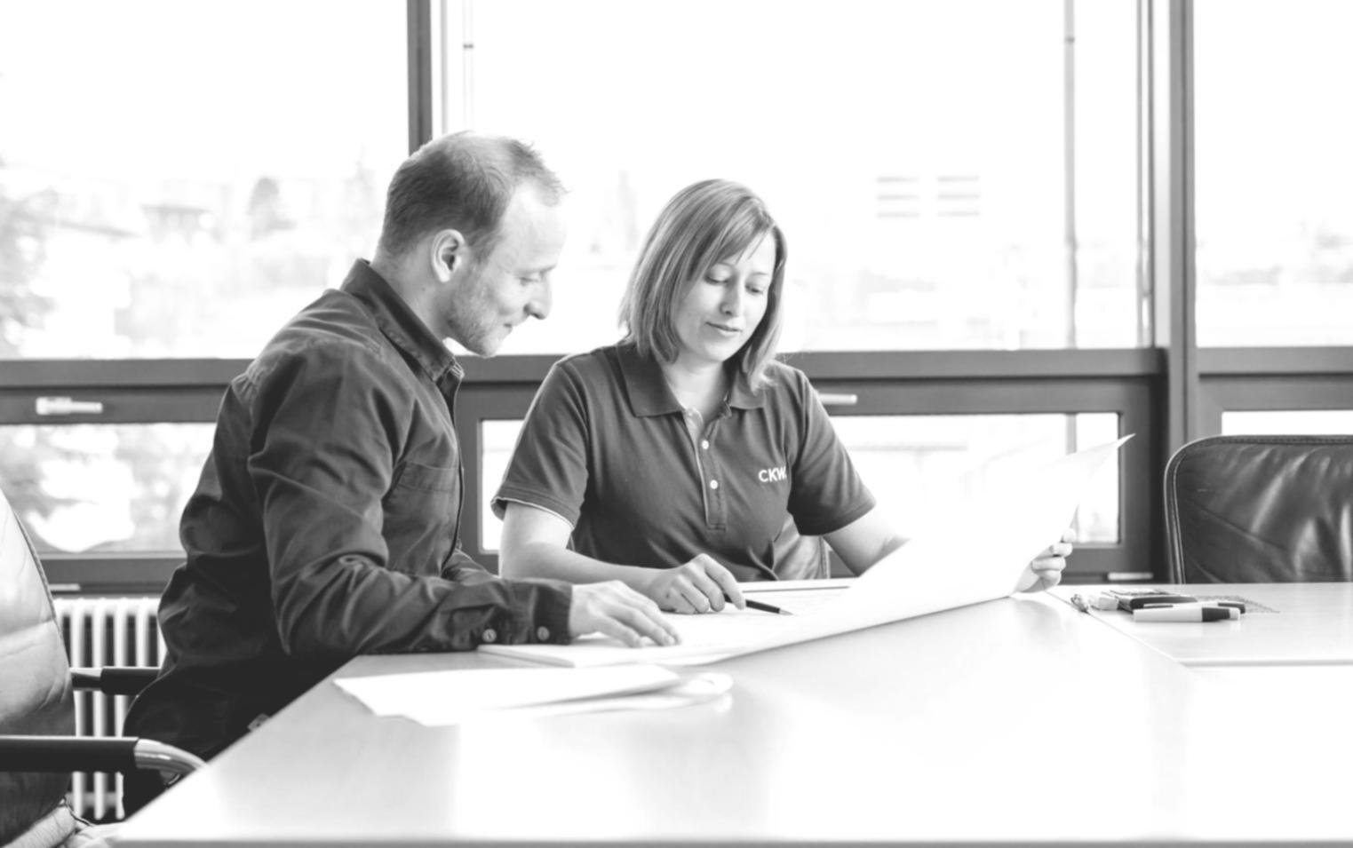 Students engaged in financial planning workshop with charts and calculators